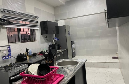 Abeokuta House | Newly renovated almost heaven 2 bdrm; large living room with view of courtyard.