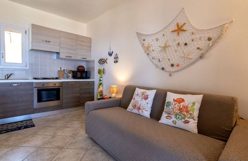 Trinita d'Agultu Apartment | Nice apartment for 4 guests with pool, A/C, TV and patio