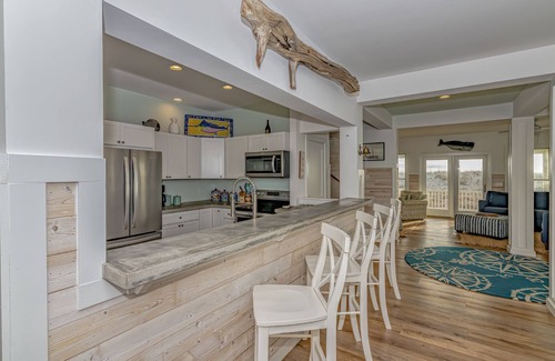 Flora's Bluff House | Ocean front home, access to both clubs and large porches! Breaking Point