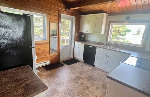 Bayview Cottage | Ocean view cottage with a perfect wrap around deck to watch beautiful sunsets.