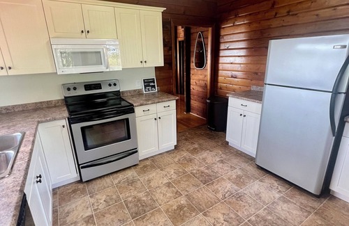 Bayview Cottage | Ocean view cottage with a perfect wrap around deck to watch beautiful sunsets.