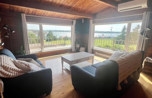 Bayview Cottage | Ocean view cottage with a perfect wrap around deck to watch beautiful sunsets.