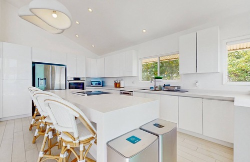 Makaha House | Oceanfront home with wrap around lanai, private sauna, beach access & WIFI