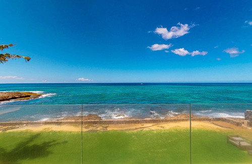 Makaha House | Oceanfront home with wrap around lanai, private sauna, beach access & WIFI