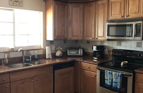 Breezeswept Beach Estates House | Oceanfront Rental With Heated Pool, Dock & Tiki Hut