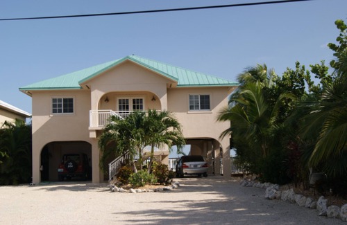 Breezeswept Beach Estates House | Oceanfront Rental With Heated Pool, Dock & Tiki Hut