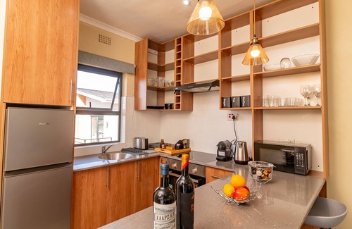 Blantyre Apartment | Oh wine at Lucas place