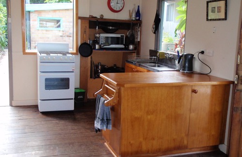 Red Rock House | Old style beach house with views of the river joining the ocean