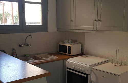 Stoupa House | One bedroom house in Stoupa village Terrace & Balcony with Sea & Mountain views.