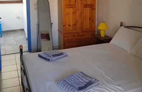 Stoupa House | One bedroom house in Stoupa village Terrace & Balcony with Sea & Mountain views.