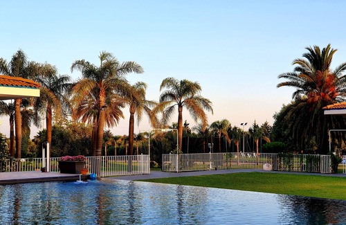 Floridia Villa | Orange house with large park and swimming pool.