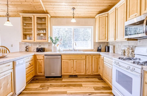 Soda Springs House | Outdoorsy waterfront home with skiing, full kitchen, foosball, & W/D