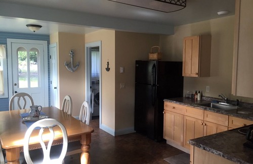 Auburn Cottage | Owasco Lake front seasonal cottage with level yard and beach