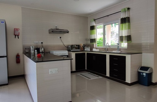 Anse aux Pins Apartment | Peace in Paradise with mountain views and 5 minutes walk to the beach