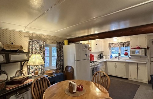 Fifty Lakes Cabin | Peaceful Vintage 1920's Lakefront Red Log Cabin
