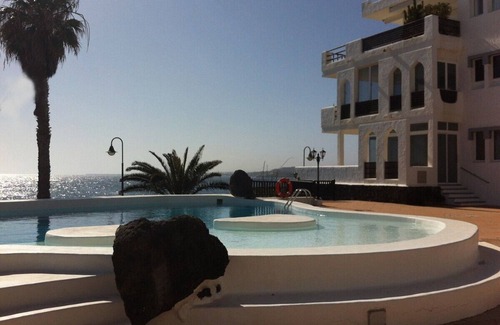 Costa Teguise Condo | Penthouse right by the sea, super complex, infinity pool, year-round season.