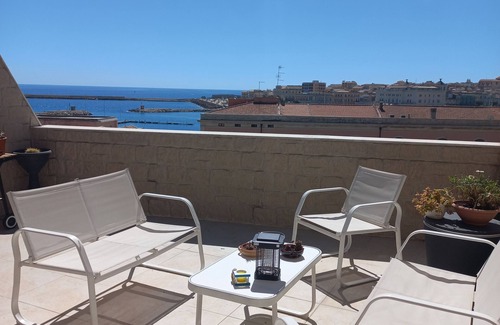 Eastern Sicily House | Penthouse with terrace, sea front overlooking Ortigia and its monuments.