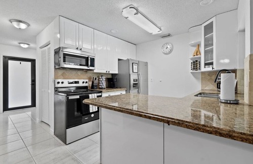 Tropic Palms Apartment | Pet Friendly 8 Min to Atlantic Ave w/Heated Salt Pool
