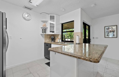 Tropic Palms Apartment | Pet Friendly 8 Min to Atlantic Ave w/Heated Salt Pool