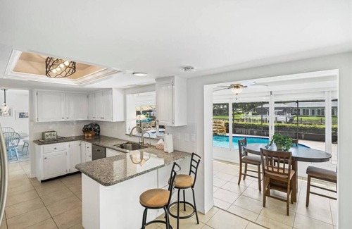 Florida Ridge House | Pool House on a Canal with Dock and Ocean Access