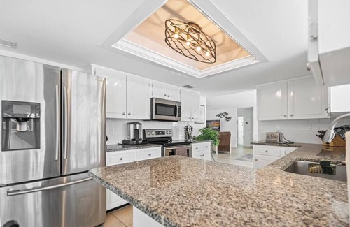 Florida Ridge House | Pool House on a Canal with Dock and Ocean Access