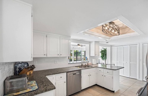 Florida Ridge House | Pool House on a Canal with Dock and Ocean Access