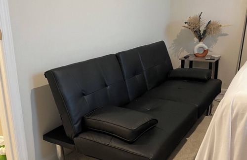 Milford House | Primary bedroom and private bathroom space. Shared kitchen and dining area