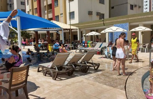Do Turista Apartment | Privé das Hhermas, 2 bedrooms one suite kitchen and living room with TV