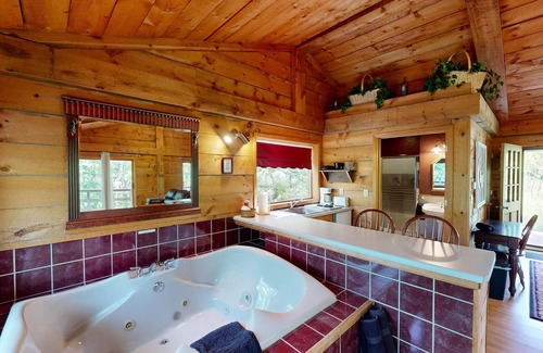 Norwalk Cabin | Quaint cabin overlooking the creek below and wetlands in the valley basin.