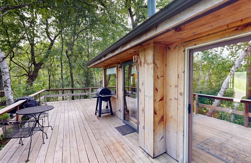 Norwalk Cabin | Quaint cabin overlooking the creek below and wetlands in the valley basin.