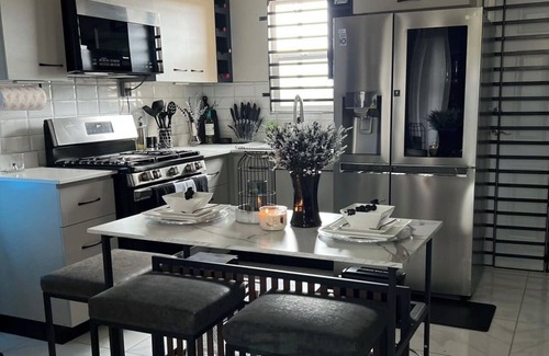 Portmore House | Refined luxury awaits you, where sophistication reigns with a Taste of Opulence!