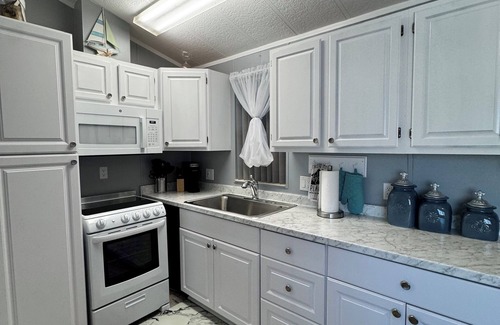 Live Oak Landings House | Relax and unwind in our inviting 55+ Mobile Home park, on the Gulf and the Bay,