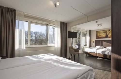 Ellecom Hotel | Relax in Luxury: Comfortable Room with Garden Views in Ellecom