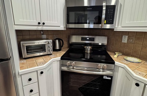 Harbor Village Condo | Relax & Unwind – Walk to the Beach from This 2BR -2BA with Pool and fishing dock