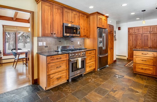 Broadmoor House | Relaxing Home with Private Hot Tub, Fast WiFi, Gas Fireplace, and Washer/Dryer