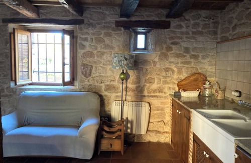 Sedano House | Renovated house with 2 bedrooms, 1 bathroom and living-dining room in stone and wood is very cozy.