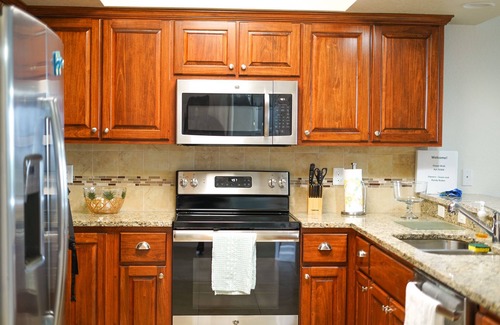 New Smyrna Beach Condo | Resort style amenities in spacious condo with beach access and direct pool view.