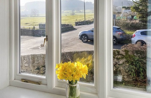 Youlgreave Cottage | River View sits beside the River Bradford with views of the hills and river.