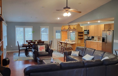 Cosby Cabin | Riverfront cabin near the Smoky Mountains with a hot tub.