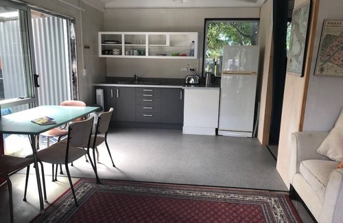 Whangamata House | Riverside Retreat - 3 Bedrooms + Fully Contained Sleepout + Hot Tub