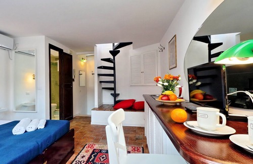 Monti Apartment | Romantic attic with a wonderful terrace, near the Colosseum