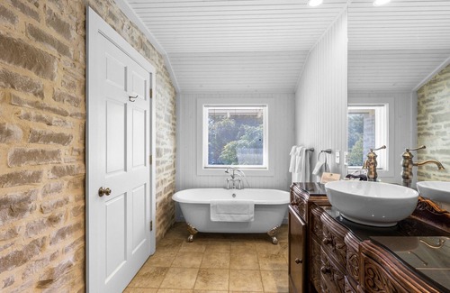 Comfort Hotel | Room with One King Bed, microwave, mini-fridge, and gas fireplace