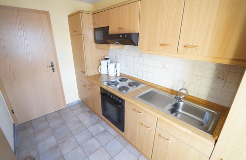 Westeraccumersiel Apartment | Schöne Ferienwohnung Windstärke12 mit Balkon