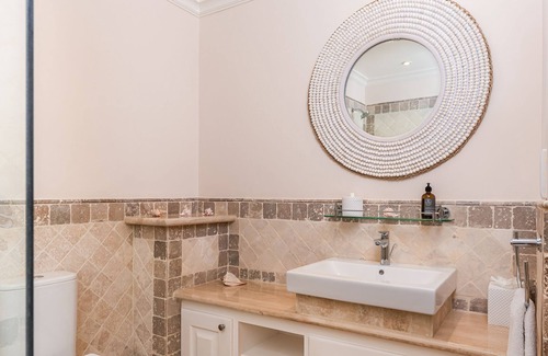 Schooner Bay Apartment | Schooner bay is a beachfront condominium with a freeform swimming pool as the focal point