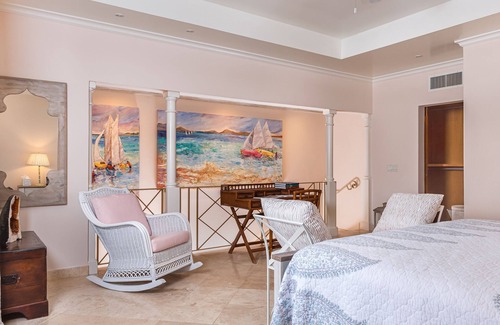 Schooner Bay Apartment | Schooner bay is a beachfront condominium with a freeform swimming pool as the focal point