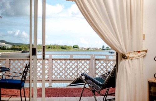 Jolly Harbour Condo | Seascape Villa 403E is a waterside condo within 10 mins walk to the Beach.