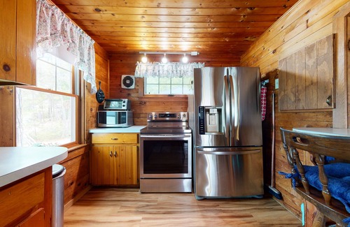 The Bays Cottage | Secluded bayfront cottage with private beach, grill, & bay views