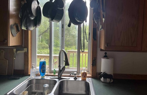 North Pole Cabin | Secluded & quiet, close to town. Stone fireplace inside & a firepit out back