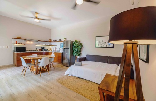 Colonos Cuzamil Apartment | Serviced 1-Bedroom Apartment · Rooftop BBQ + Pool · Bikes · Security