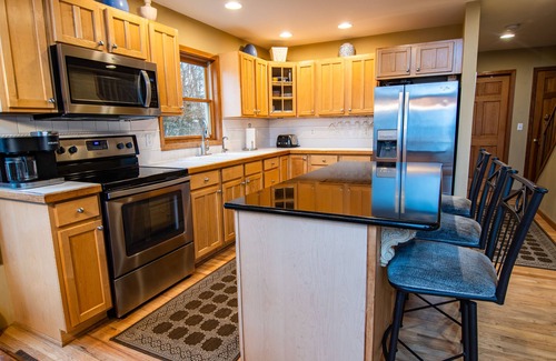 Onekama House | Seven Bedroom Home on Lake Michigan & short walk to Portage Lake